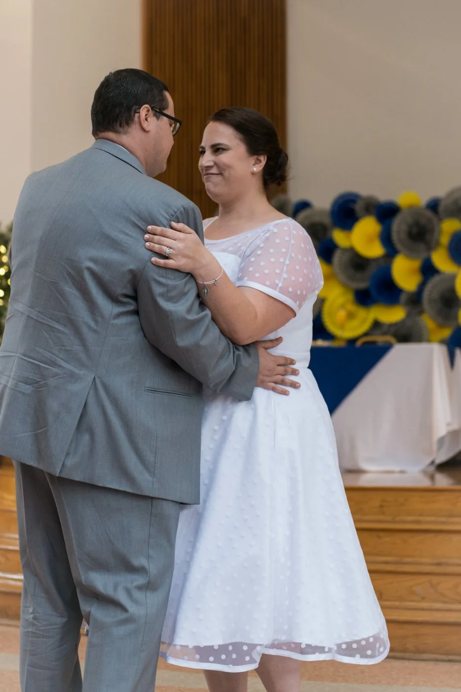 The bride and groom dance together at their wedding reception at St Mark Catholic Church in Vienna, Virginia