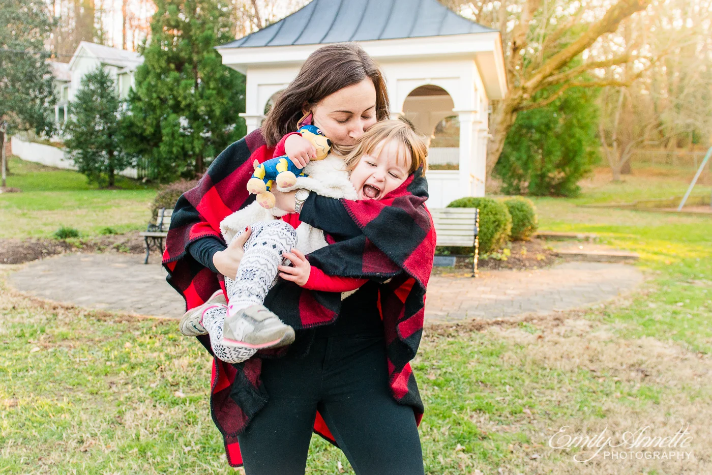 A young girl playing with her mom at Clifton Town Park in Fairfax County, Virginia