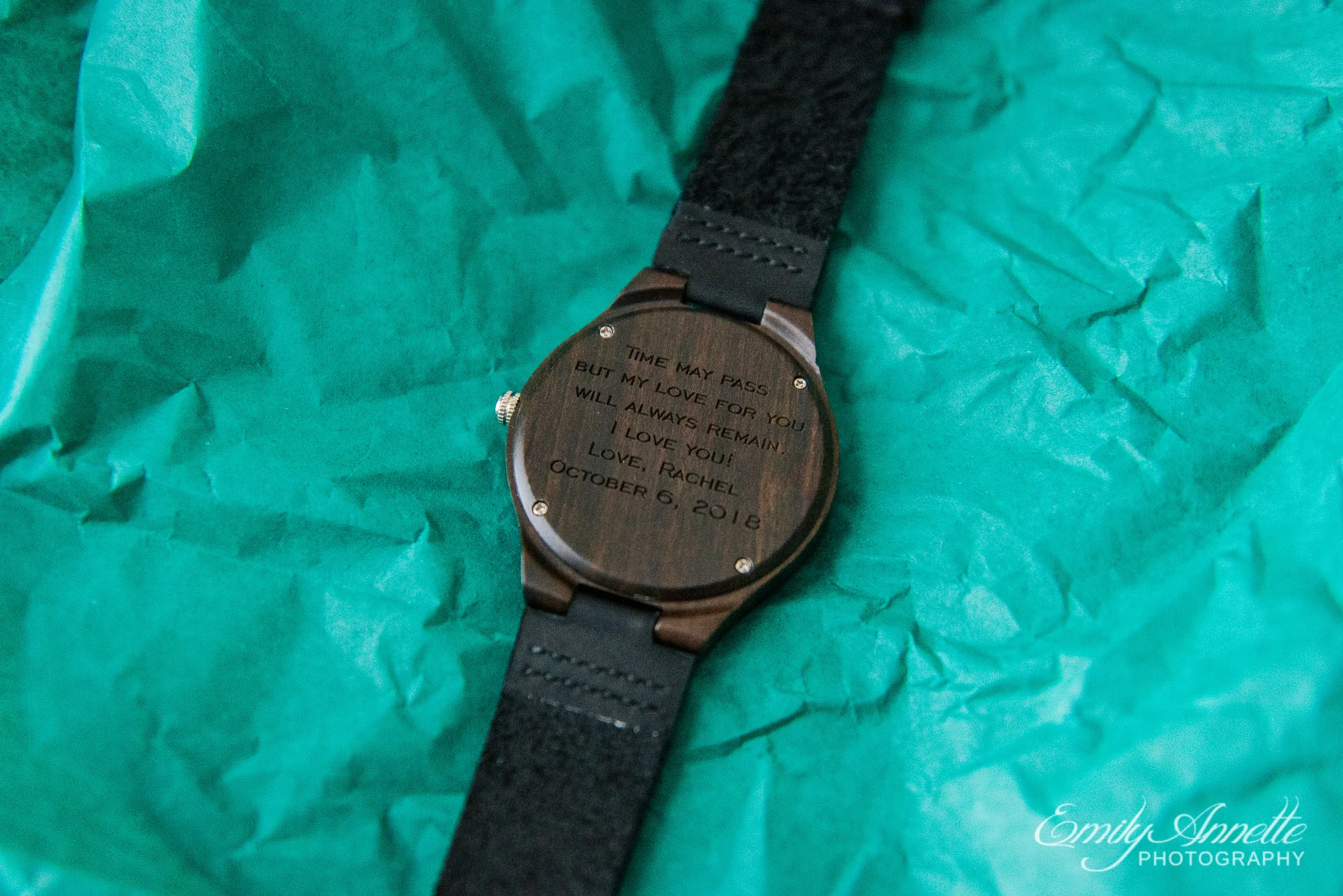A personalized engraved wooden watch given to the groom from the bride before their wedding ceremony at Amber Grove near Richmond, Virginia