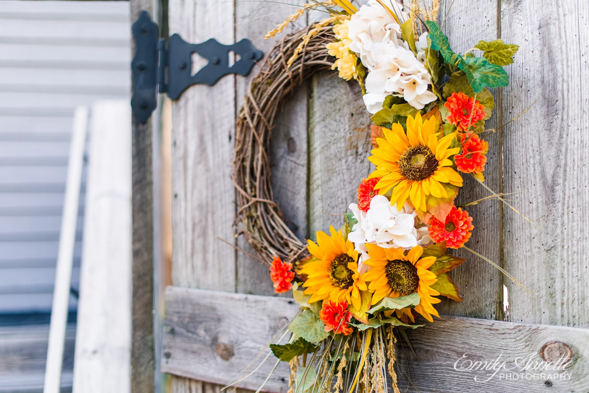 A fall wreath hanging outside the ceremony site during a country wedding at Amber Grove near Richmond, Virginia
