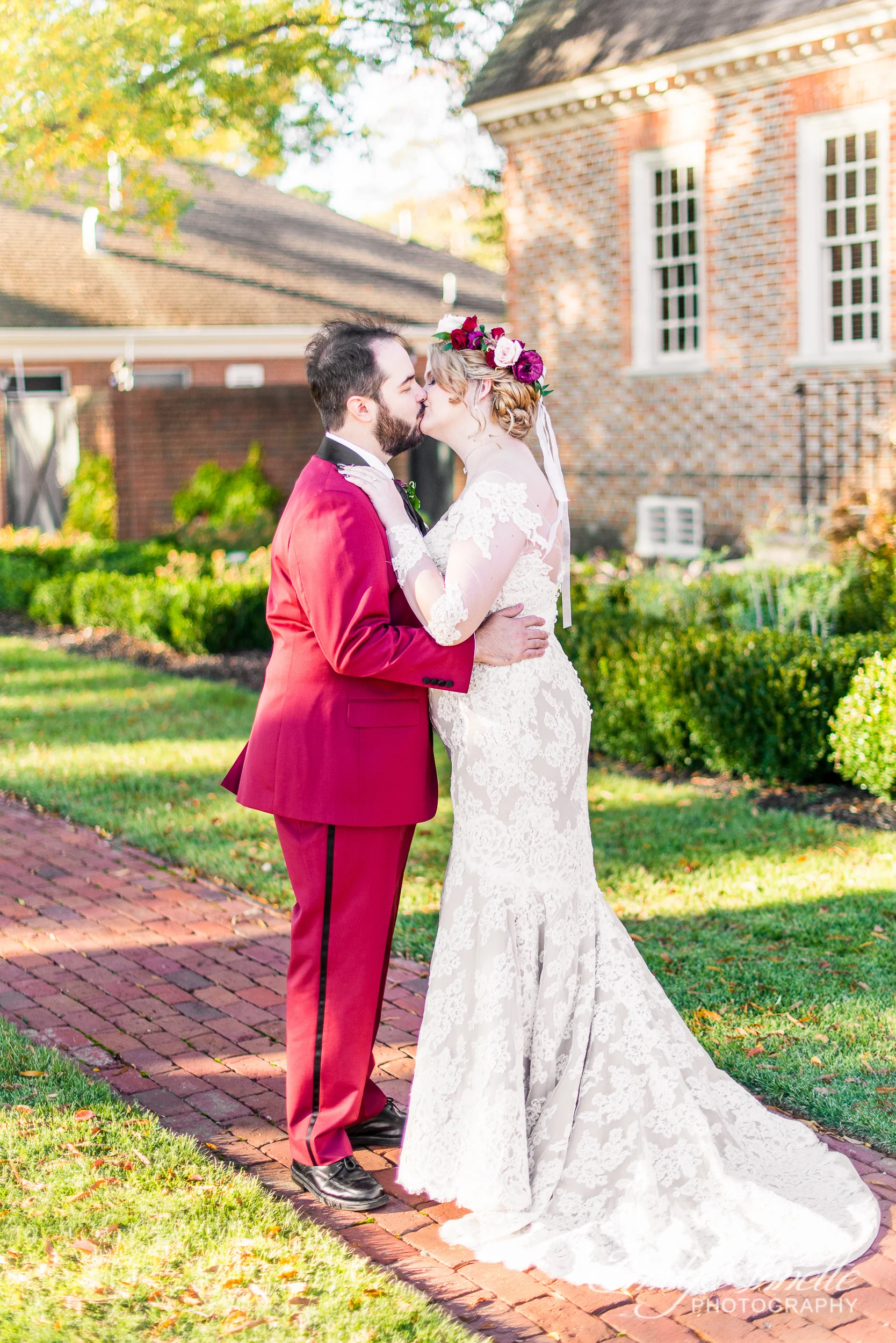 A groom kissing his bride on their wedding day at Willow Oaks Country Club in Richmond, Virginia