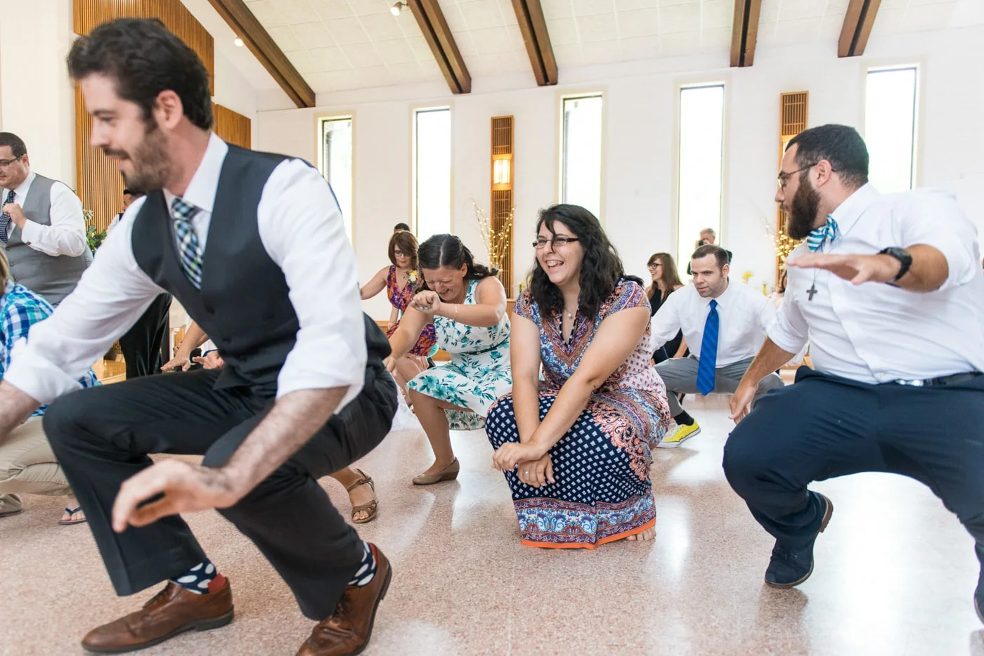 Guests dancing and having fun at a wedding reception at St. Mark Catholic Church in Vienna, Virginia