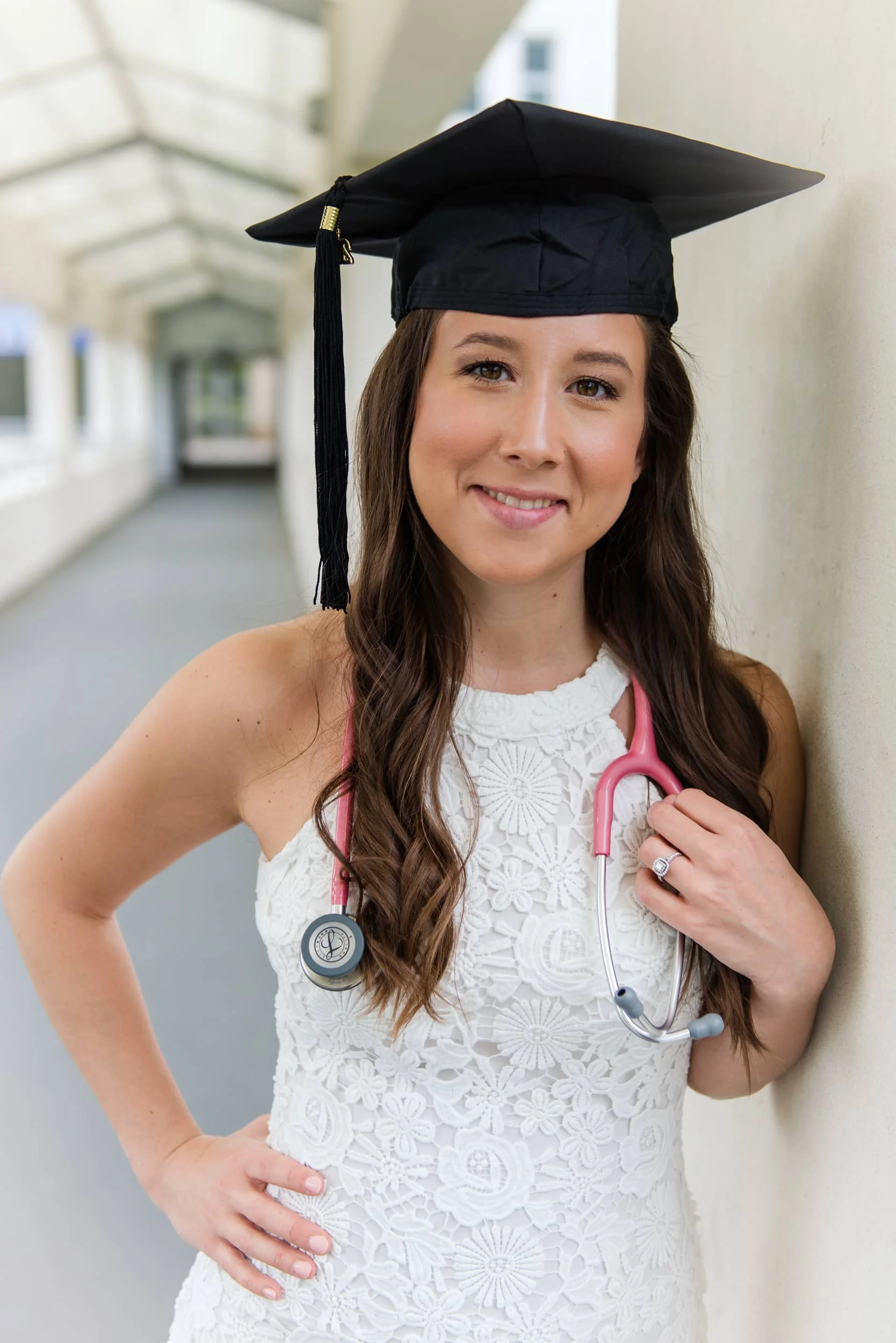 A nursing student wears her graduation cap and stethoscope for a grad session at Marymount University in Arlington, Northern Virginia