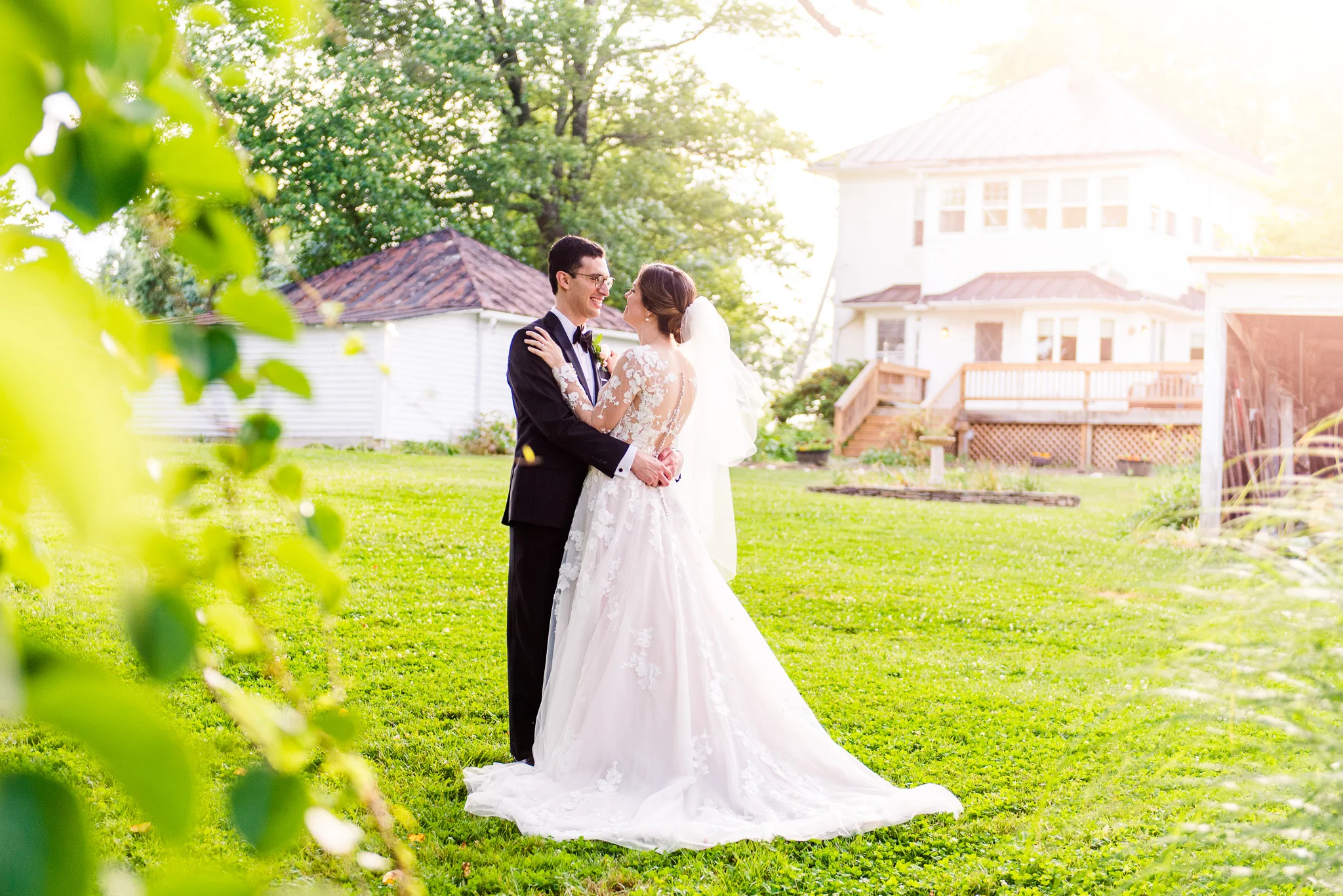 A bride and groom embrace during golden hour at The Barns at Hamilton Station Vineyard in Leesburg, Northern Virginia