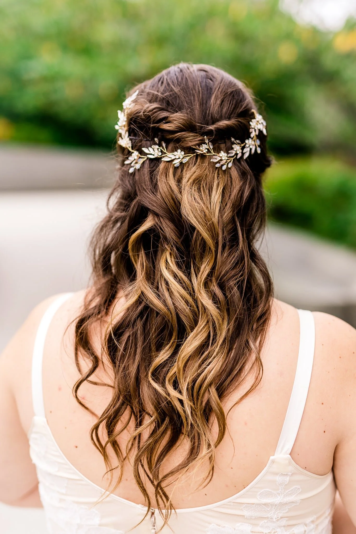 Details of a bride’s hair featuring a bridal hair vine hairpiece on her wedding day at the Tidal Basin near the MLK Memorial in Washington, DC