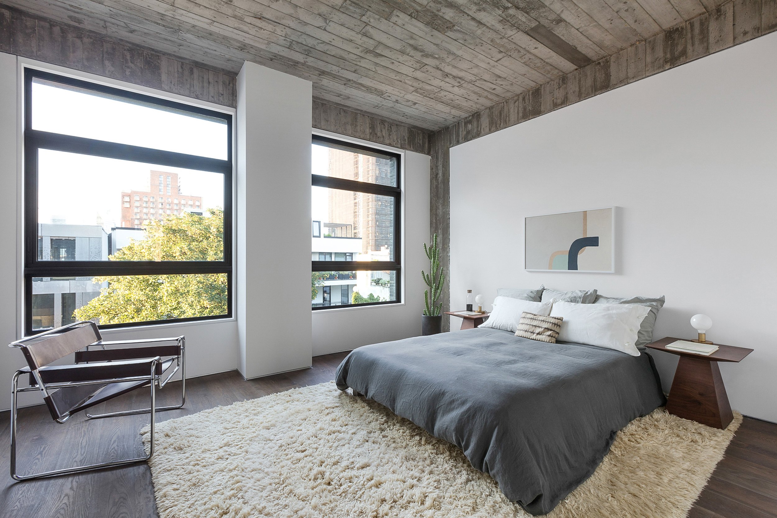  Hovey Design  Wythe Lane   A large bedroom is staged by Hovey Design. This 5 level townhome with underground garage parking adjacent to the basement, a private garden, and a private roof deck with expansive views is amazing located on the south side