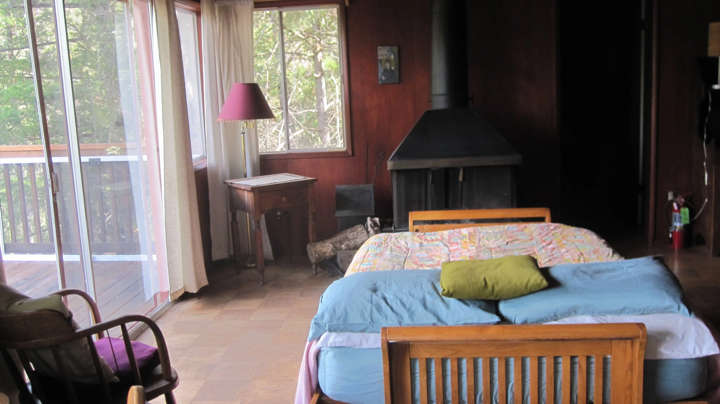 Living Room Founders Cabin futon and stove.jpg