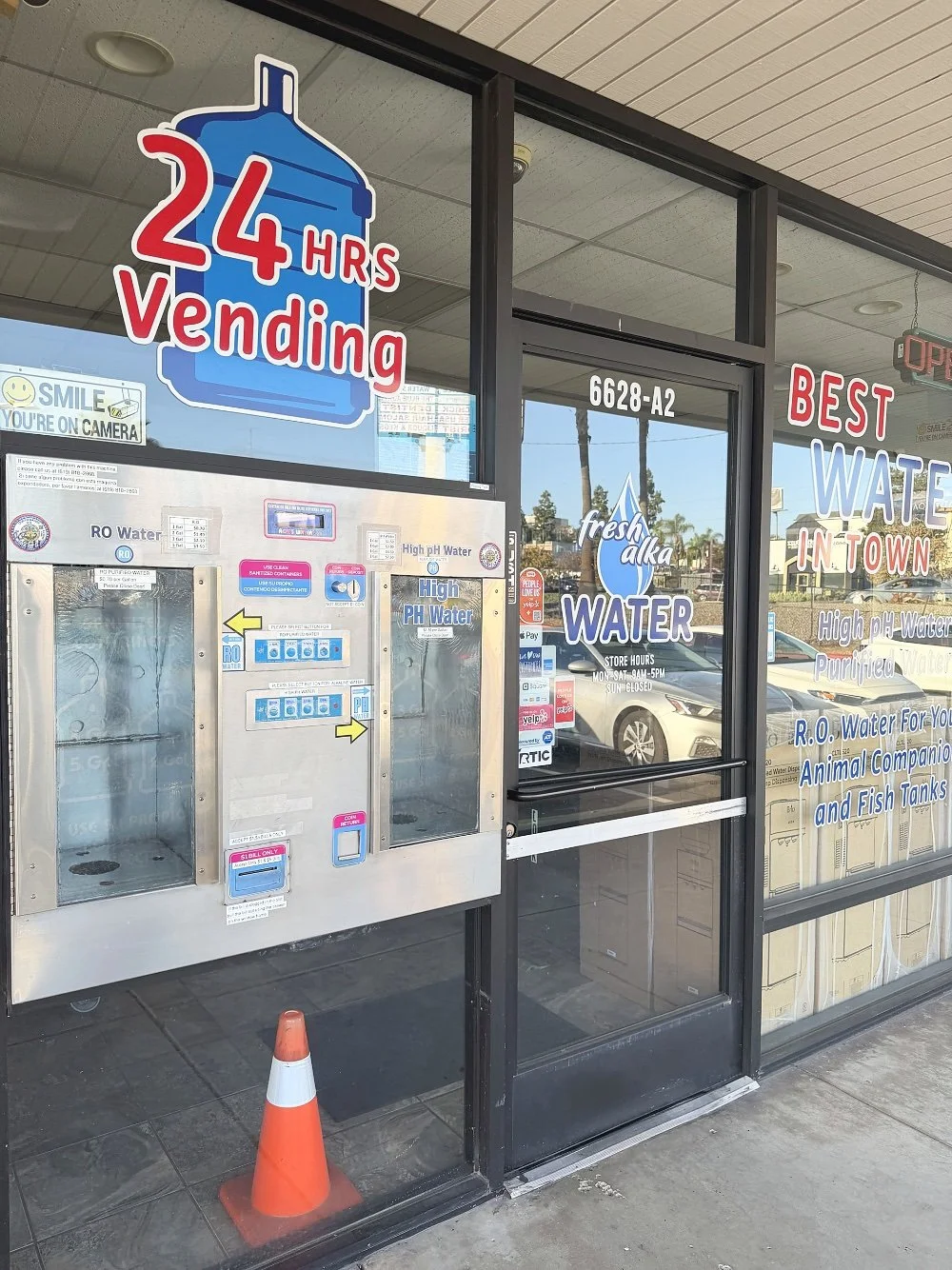 24-hour water vending machine outside Fresh Alka Water on Mission Gorge Road in San Diego — refill purified or alkaline water anytime, cash only