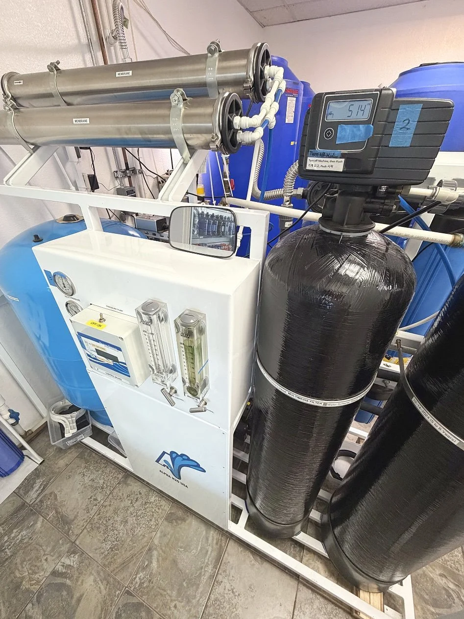 Reverse osmosis tanks and purification equipment at Fresh Alka Water in San Diego, producing purified water for refills