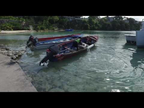 Jamaican man bails out wooden boat