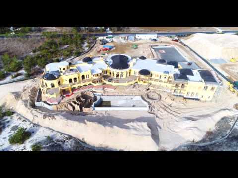 Aerial 360 degree flight around large estate under construction, Southampton, NY_150%