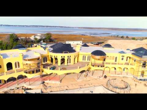 Low approach to grand oceanfront mansion, Southampton, NY
