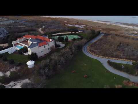 360 degree aerial flight around grand oceanfront houses in Southampton, NY