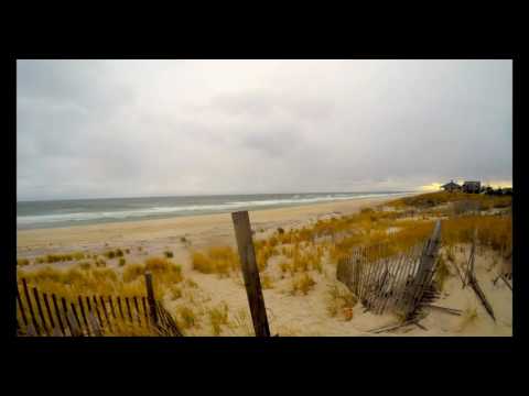 Timelapse video of ocean beach on windy and cloudy November afternoon