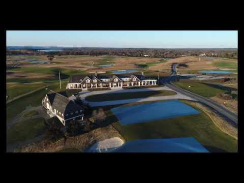 Slow descent in front of country club clubhouse on sunny winter day, Hamptons
