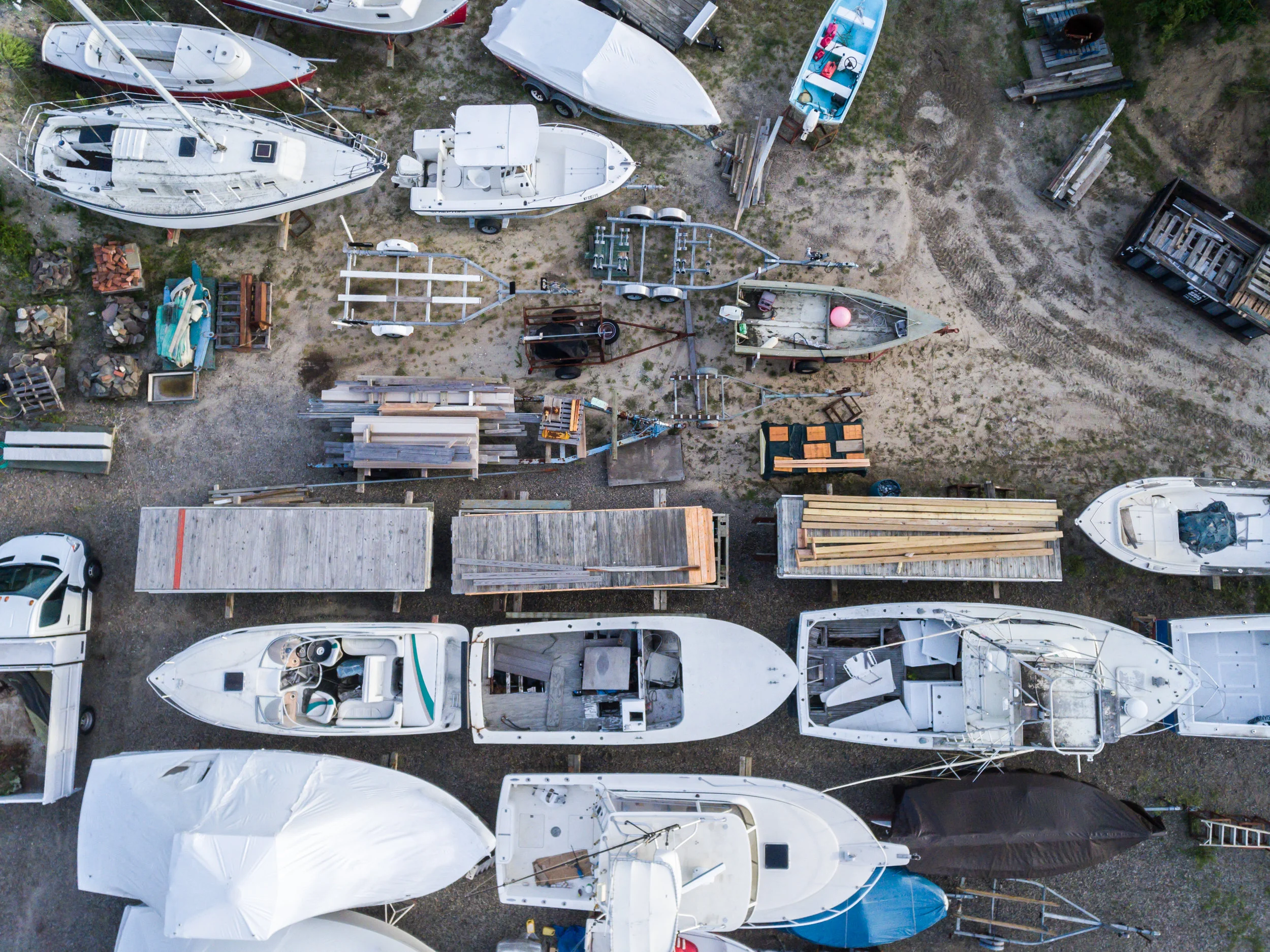Collection of boats in boatyard, Hampton Bays, NY.