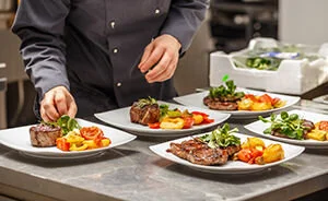 Chef is decorating delicious dish