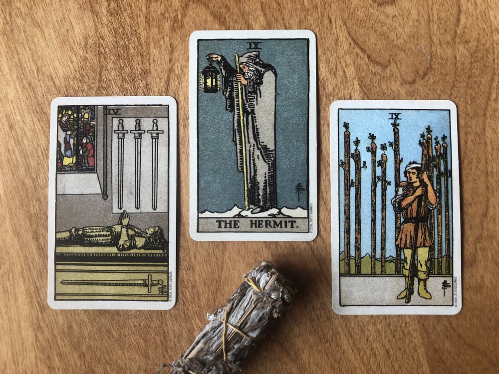 three card tarot reading with rider-waite-smith deck four of swords the hermit nine of wands