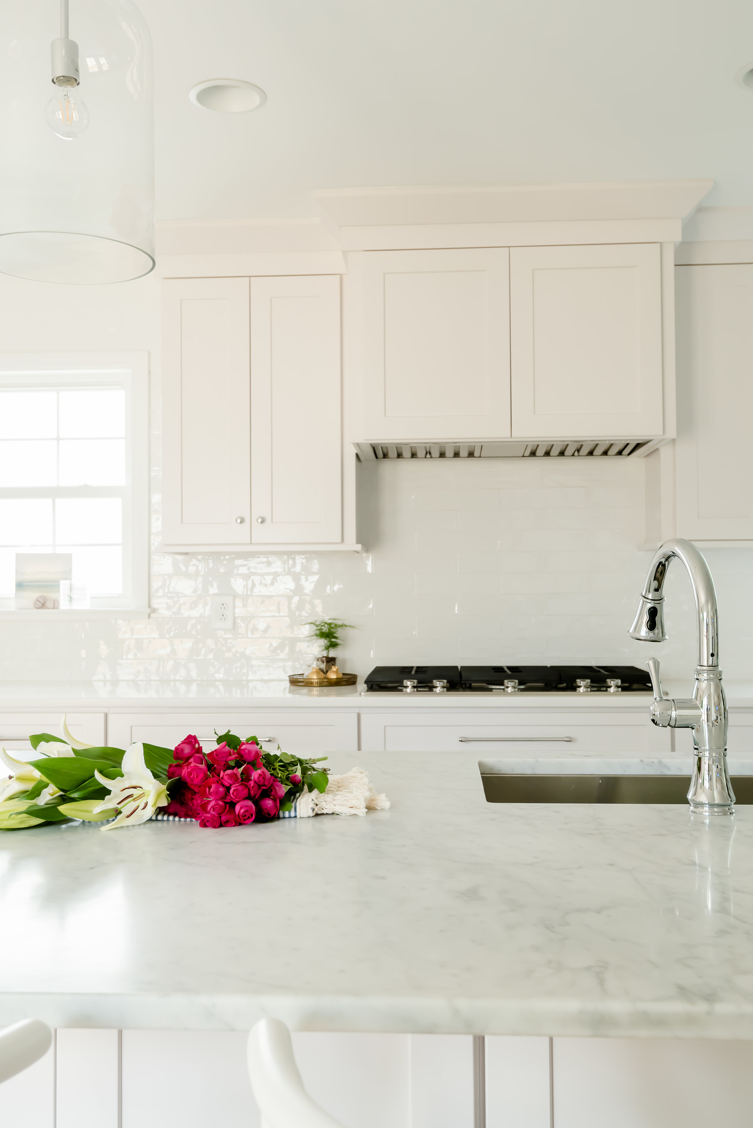  carrara marble was used for the island countertops and we used a quartz (caesarstone in blizzard) for the rest of the countertops. 