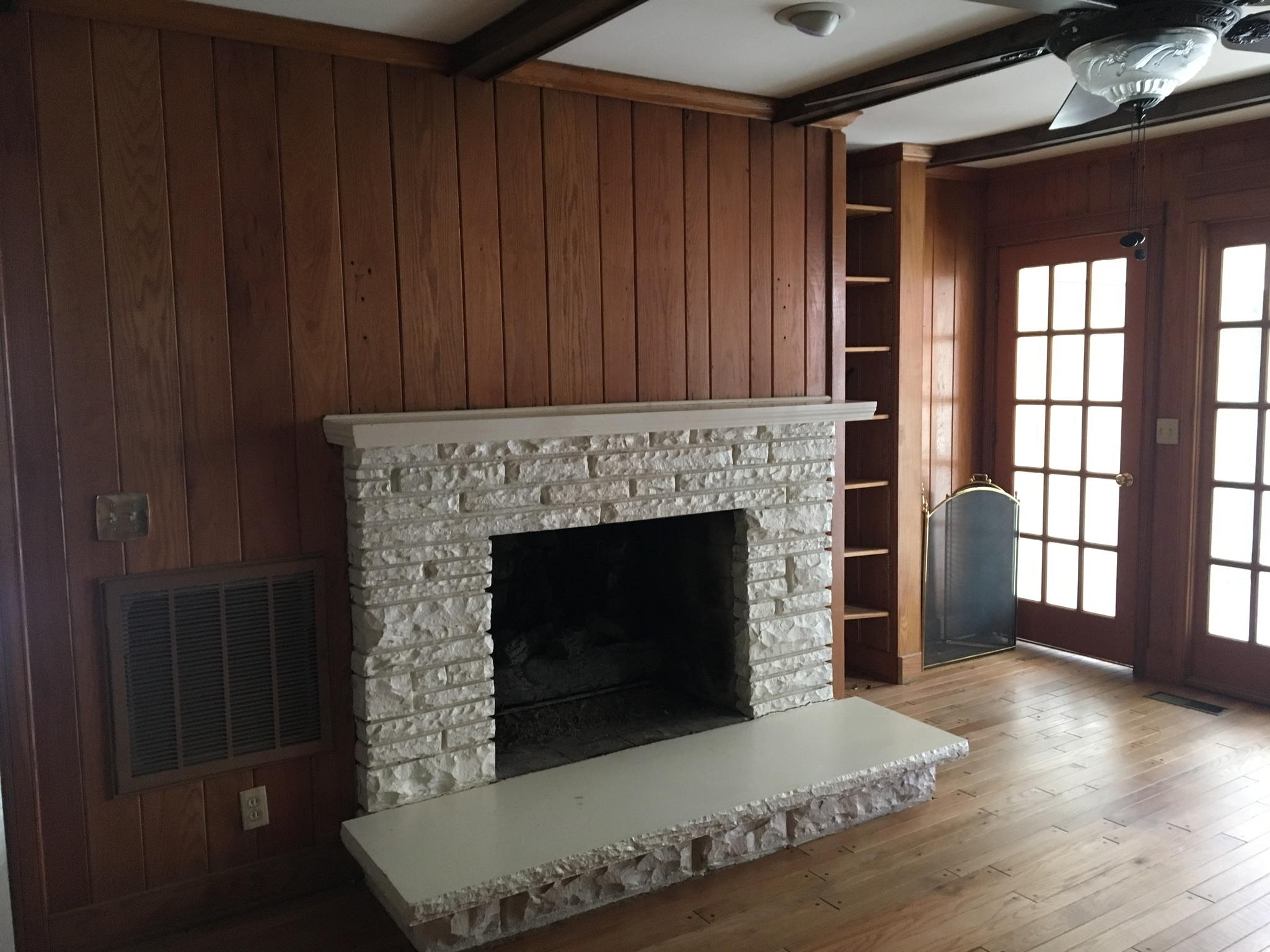  who knew that there was a beautiful fireplace behind all of that stone and paneling. 