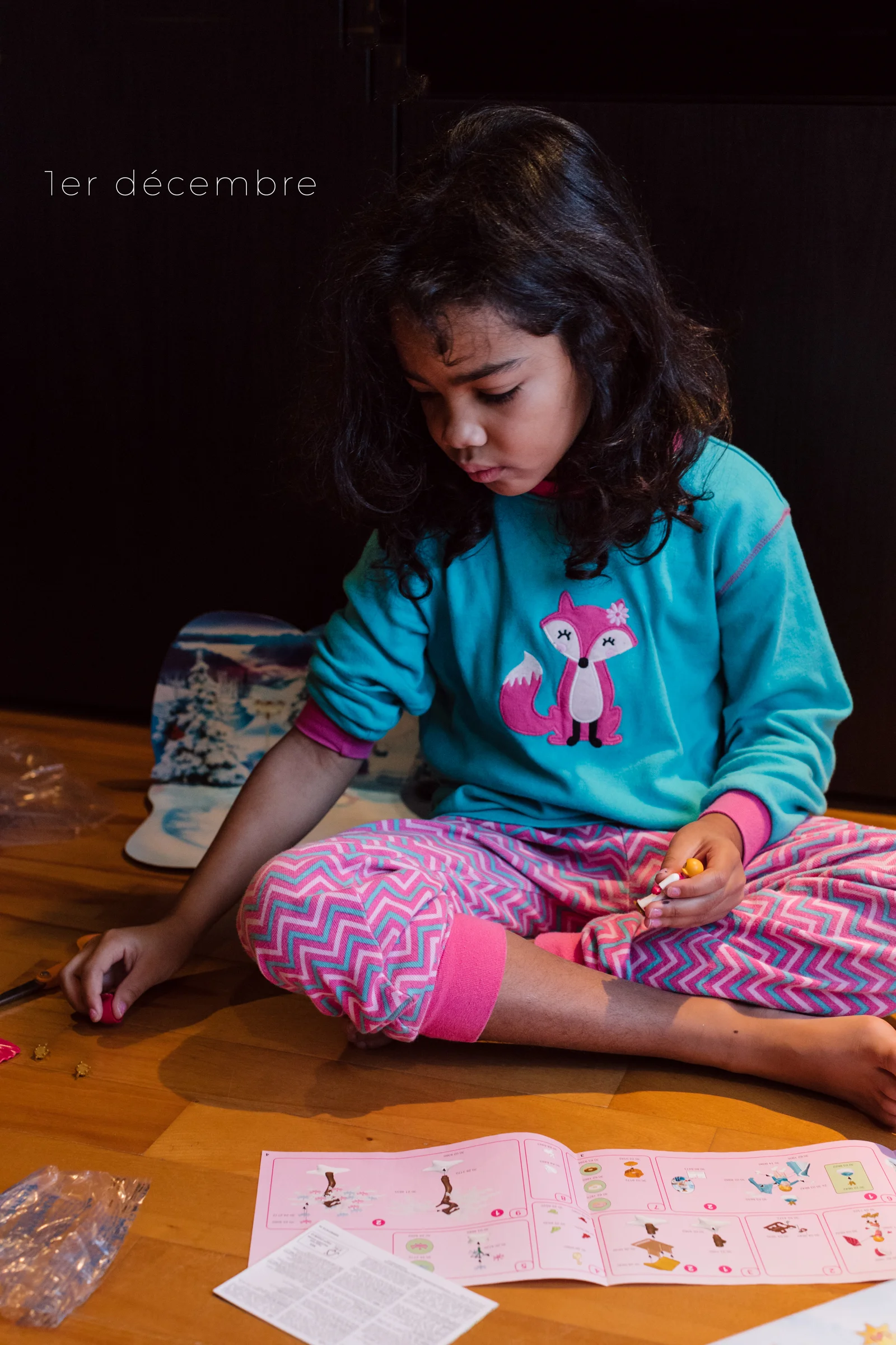 Assembling the first toy of her advent calendar