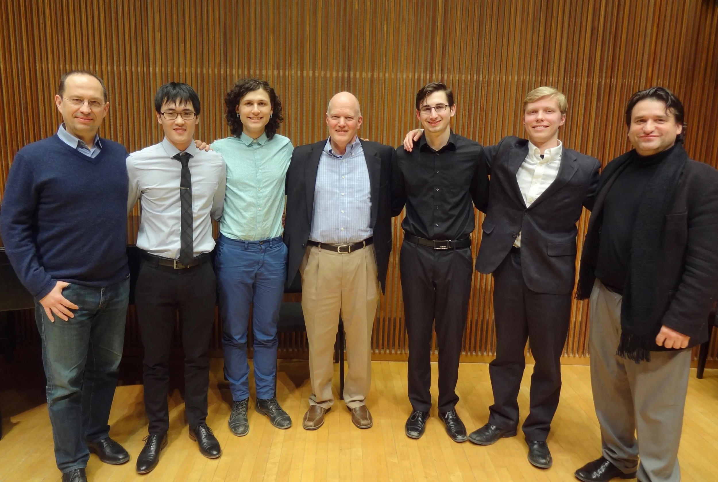 The judges and the winners. James Stroud, center.