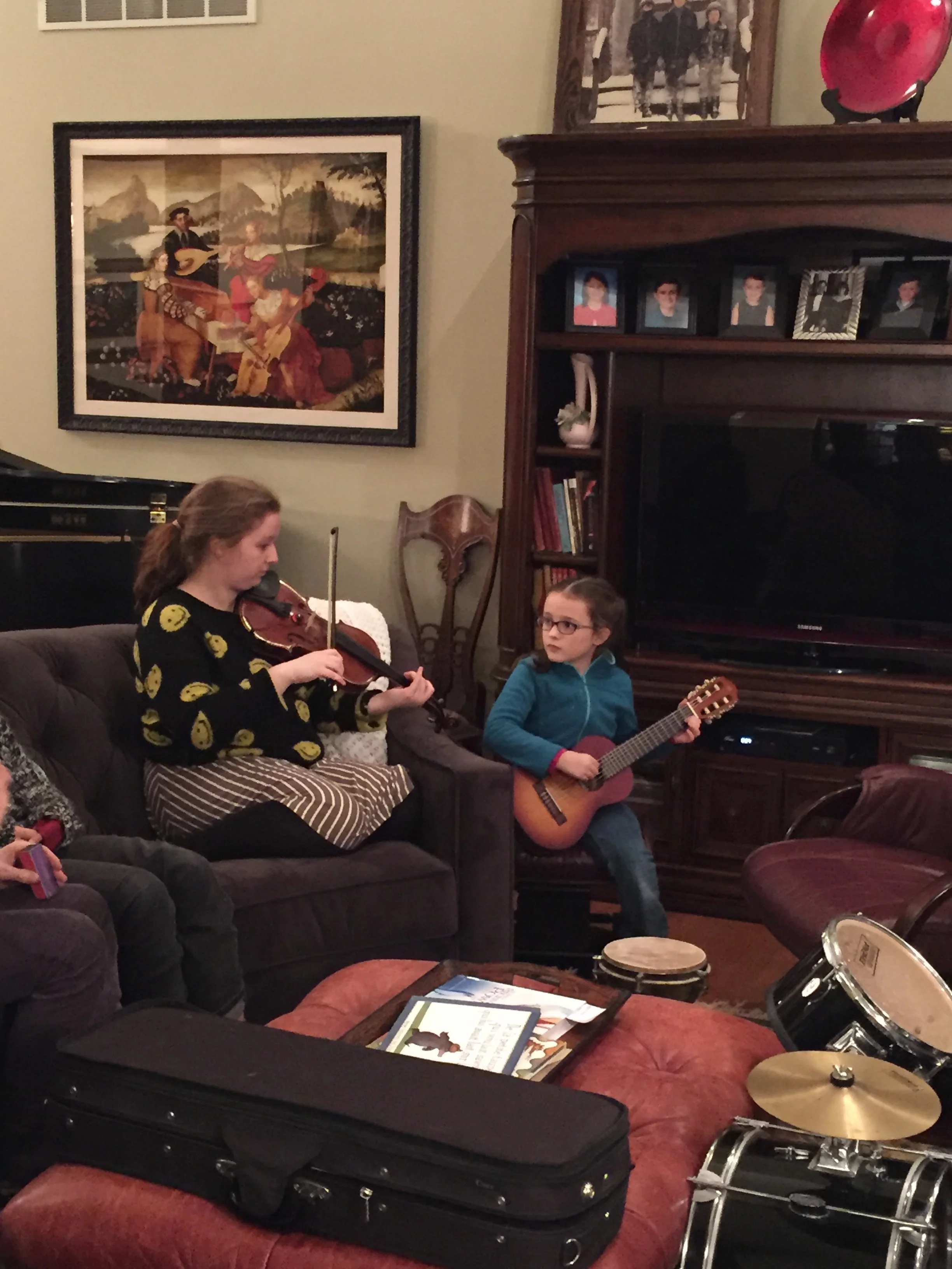 Flora, 7, who’d had a few introductory guitar lessons, was fascinated by the proceedings.