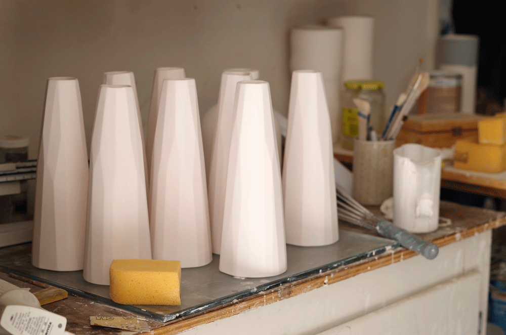 studio-shot-pottery-bisqued-vases-glazing-tableL.gif