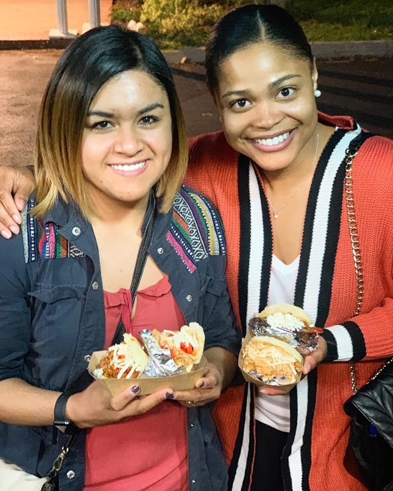 two girls with arepas.jpg