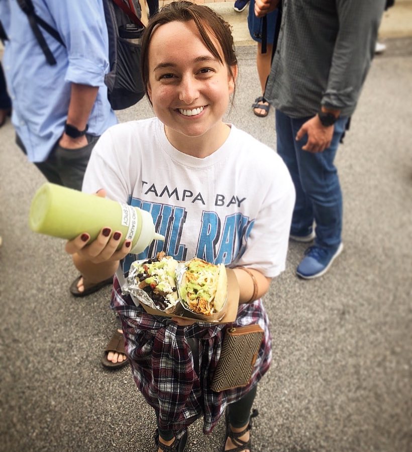 girl pouring cilantro sauce.jpg