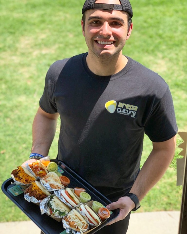 marcel with arepas.jpg