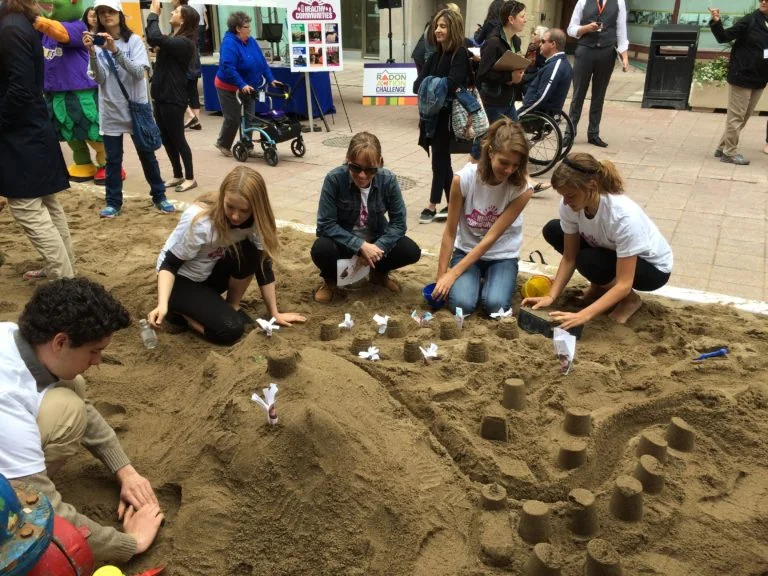 EduTOX winners join the Healthy Communities sandcastle-building team.