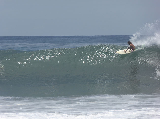 Local surfer coming off the top, Punta Roca