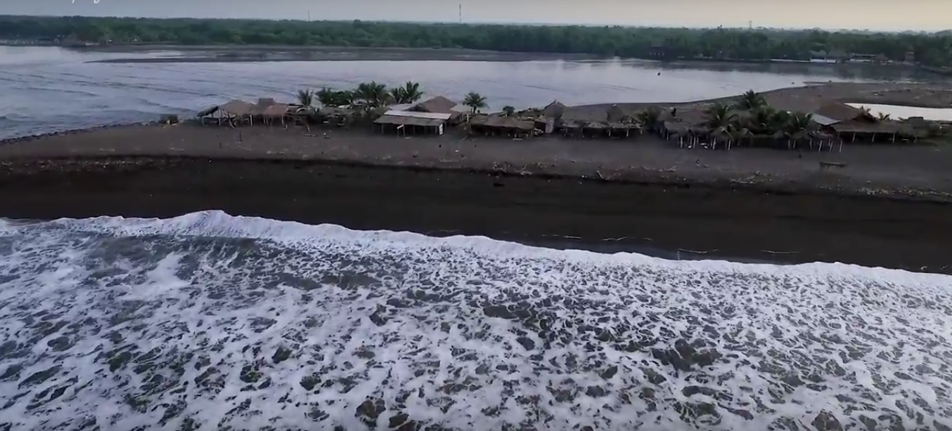 The beach shacks in front of the waves where we were to base ourselves for the morning. You can see the river we just crossed in the panga (you can paddle this easily enough too, we didn't as we had the video crew with us)