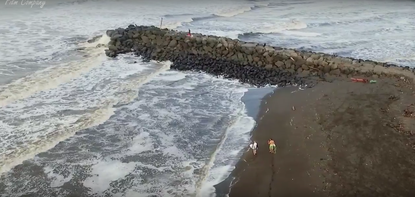 The paddle out is next to the small jetty. Surf Guide Mike and Kinder about to enter.