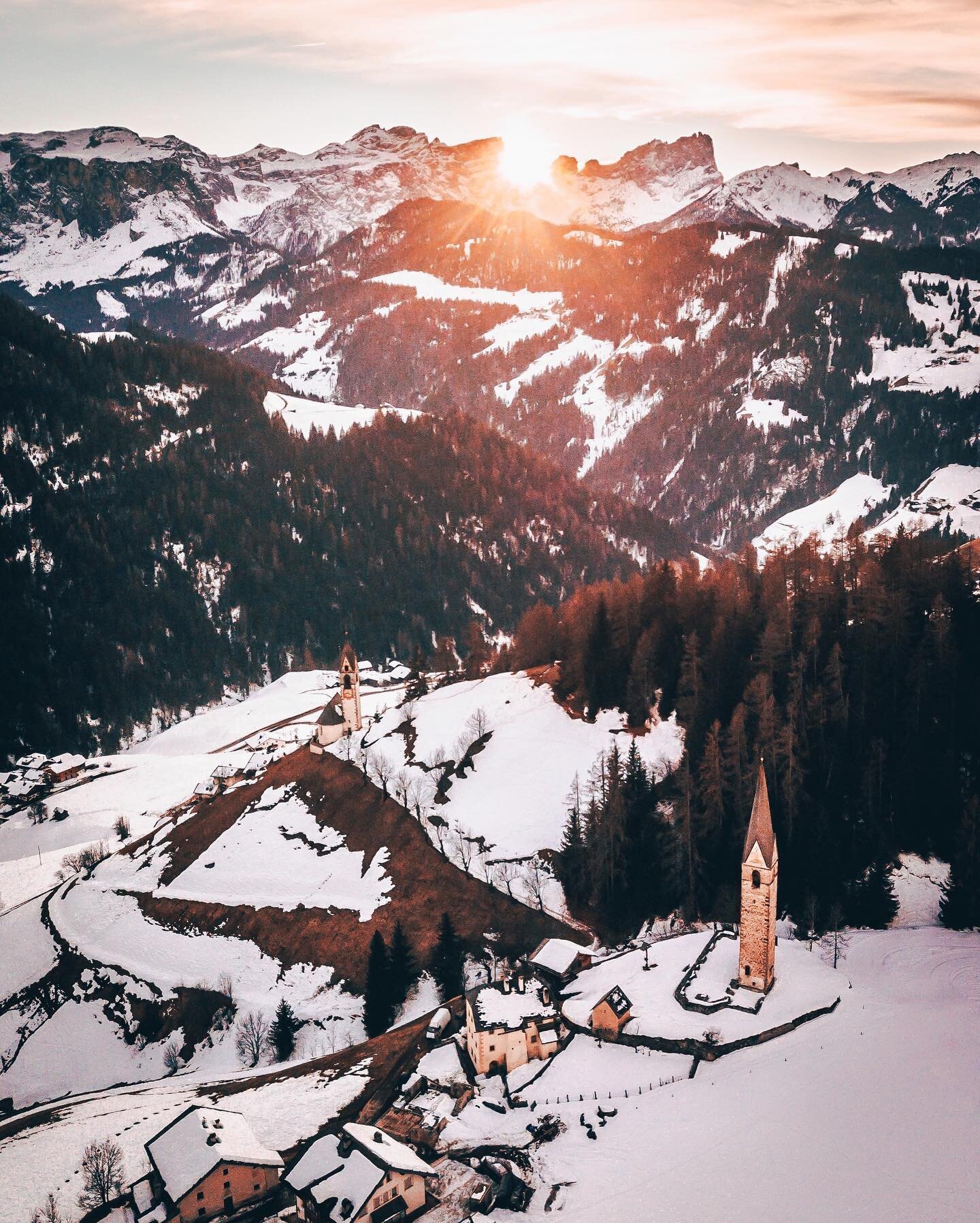 Chasing sunsets in #Dolomites 😍🌄🇮🇹#southtyrol #mastertravelphotography #altabadia #chasingsunsets #italy #travel #church #fromwhereidrone #winter #snow