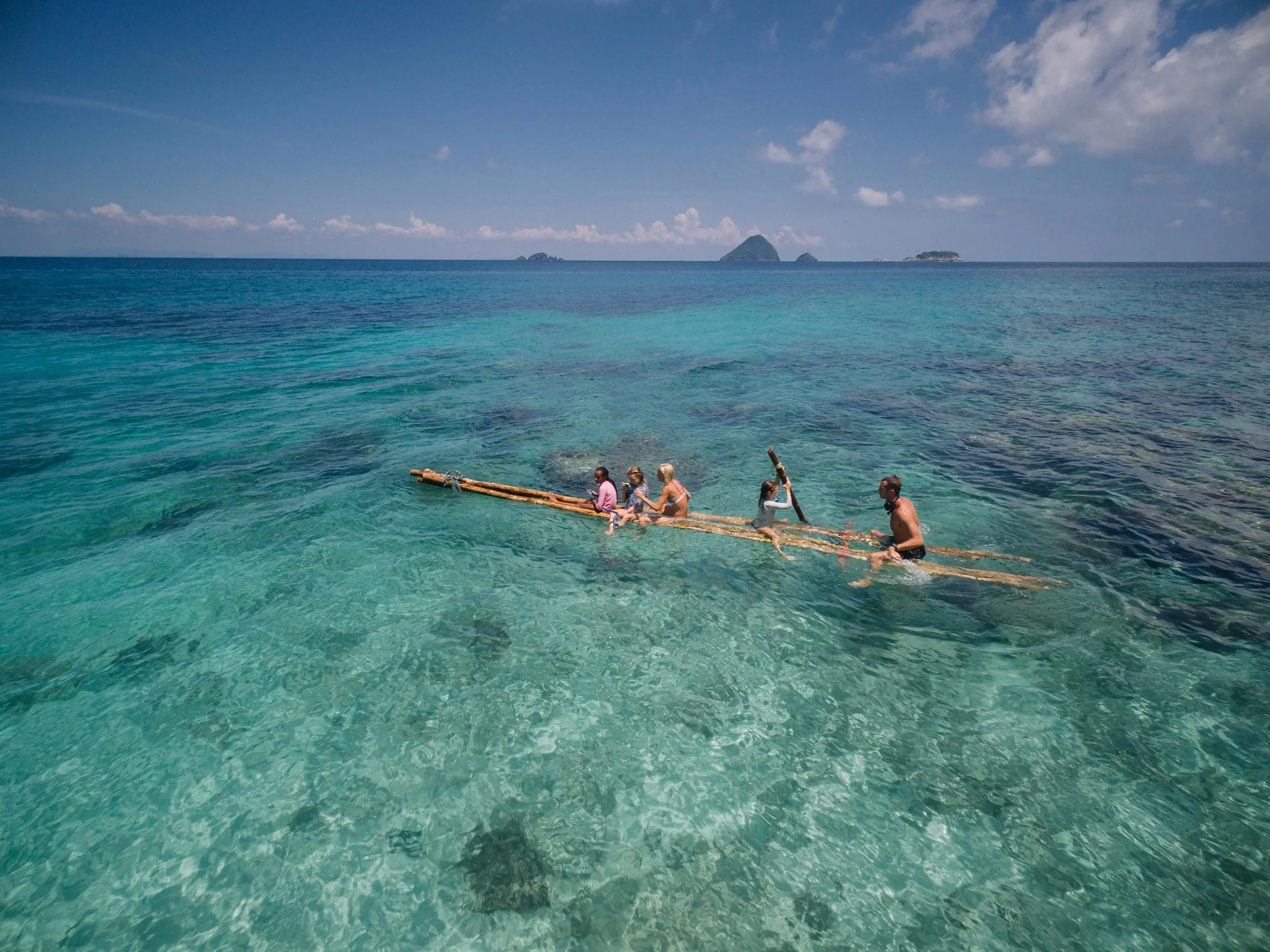 After getting dropped off on "Adam and Eve Island", a remote and beautiful white sand slice of paradise in the Perhentian islands, the girls got right to work fixing up an old bamboo raft they found ashore. After a few minor additions and some creative engineering, we were off for a test drive. The beautiful turquoise water and marine life below provided an amazing afternoon for us all. 