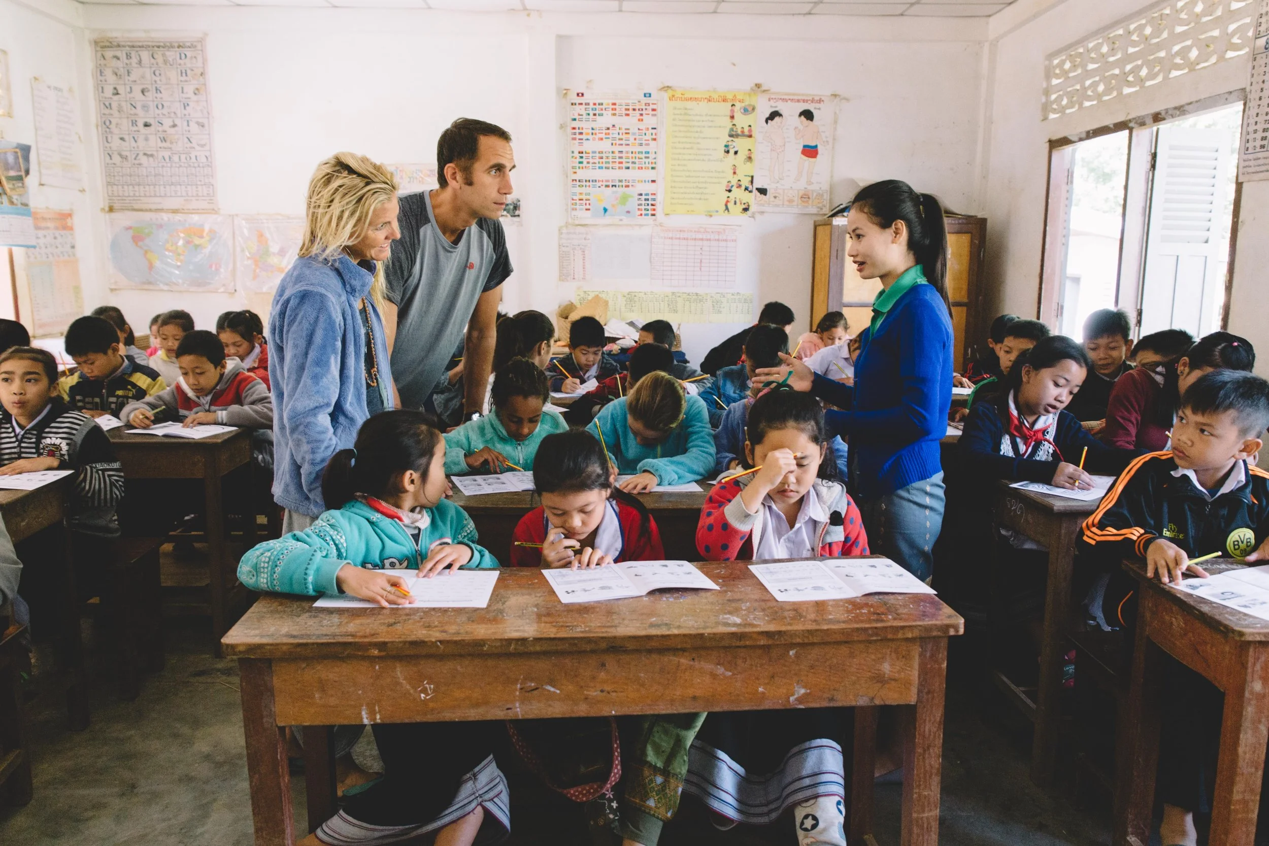 The girls joined a 5th class for the day in Luang Prabang, Laos. They read the children stories in english, learned some songs in Lao, and Mom even led a yoga class during recess. The highlight of the day was being able to donate 300 new reading books to the school at the end of our visit. The children instantly sat down and were so excited to have new materials to read. 