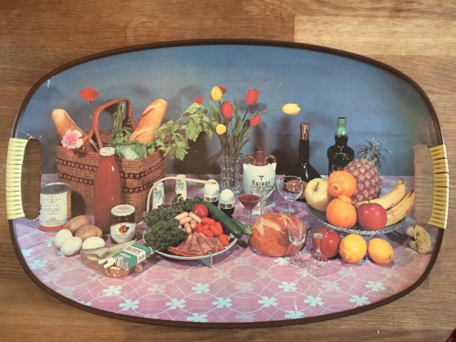 Because everyone needs a tray with broccoli, carnations, sausages and a packet of fags on it.