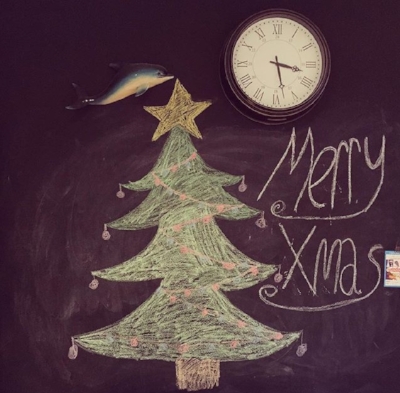 Ella's artwork. I have no idea why the flying dolphin is there.