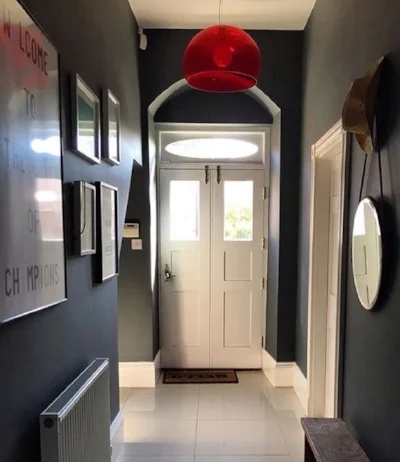 Our current hallway complete with spider family living in Kartell Fly Lamp.