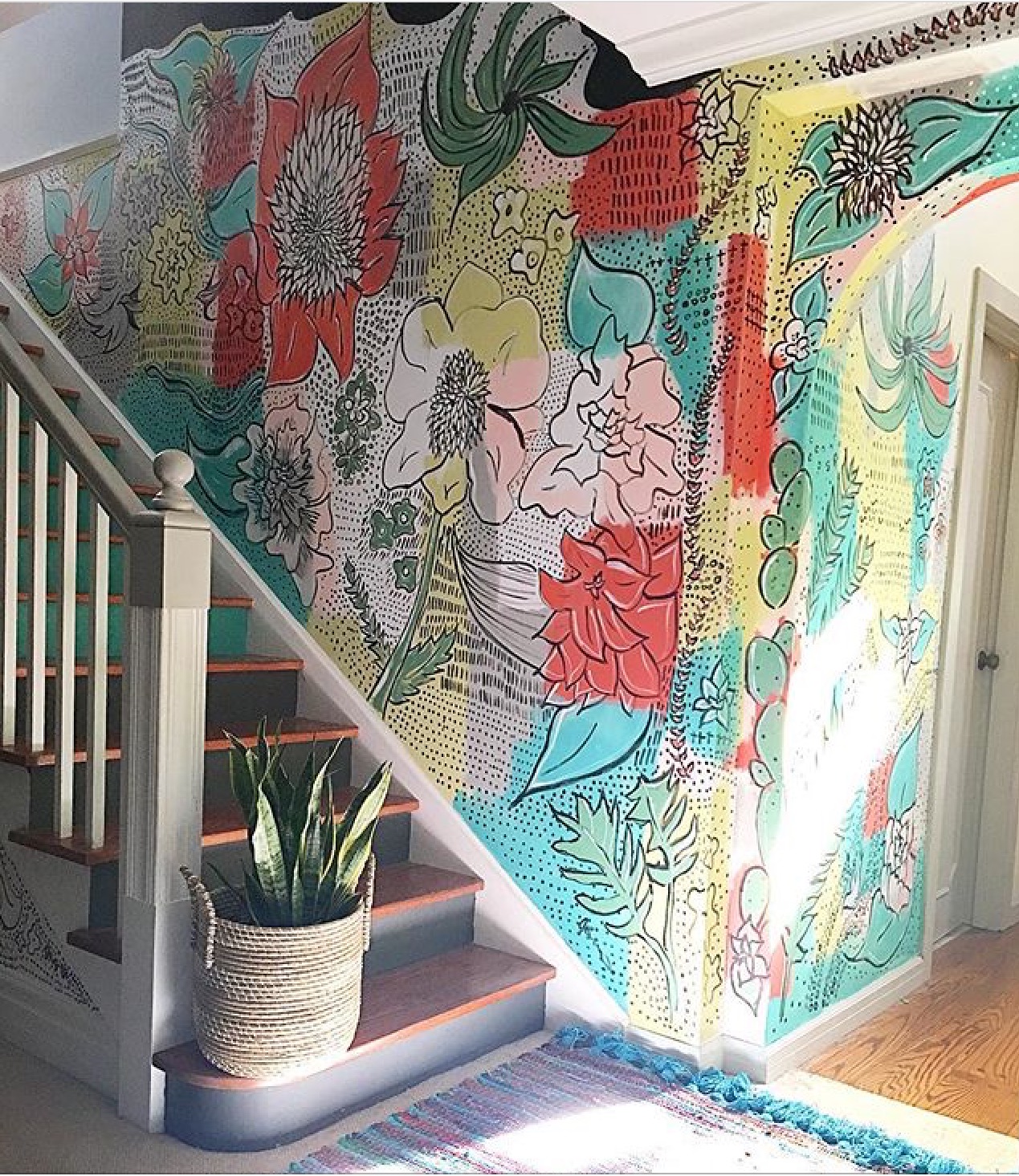 A hand painted mural and stairs make Jen Streeter 's hallway stand out. Damn, this girl is GOOD.