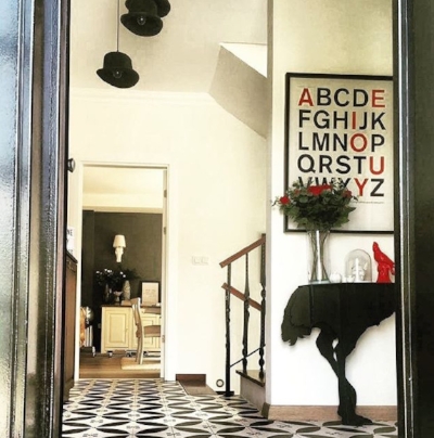 Jayne Girginc 's bowler hat light fittings add an eclectic touch to this space.