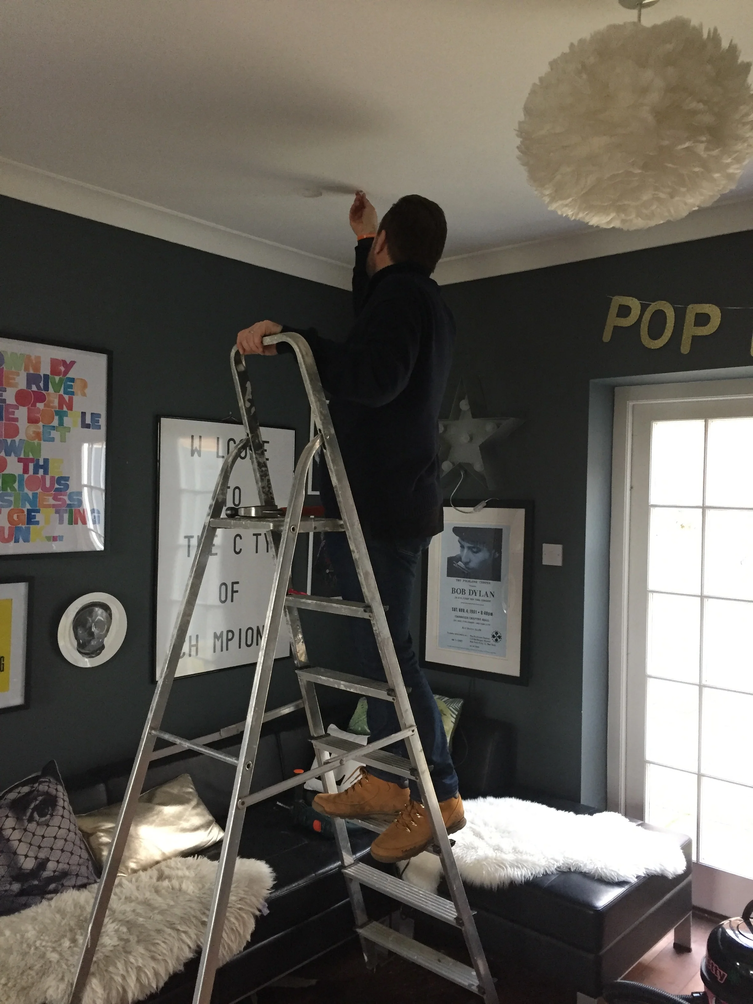 Joe attempting to hang a disco ball. You've never actually seen a disco ball hung in my bar because it fell out immediately.