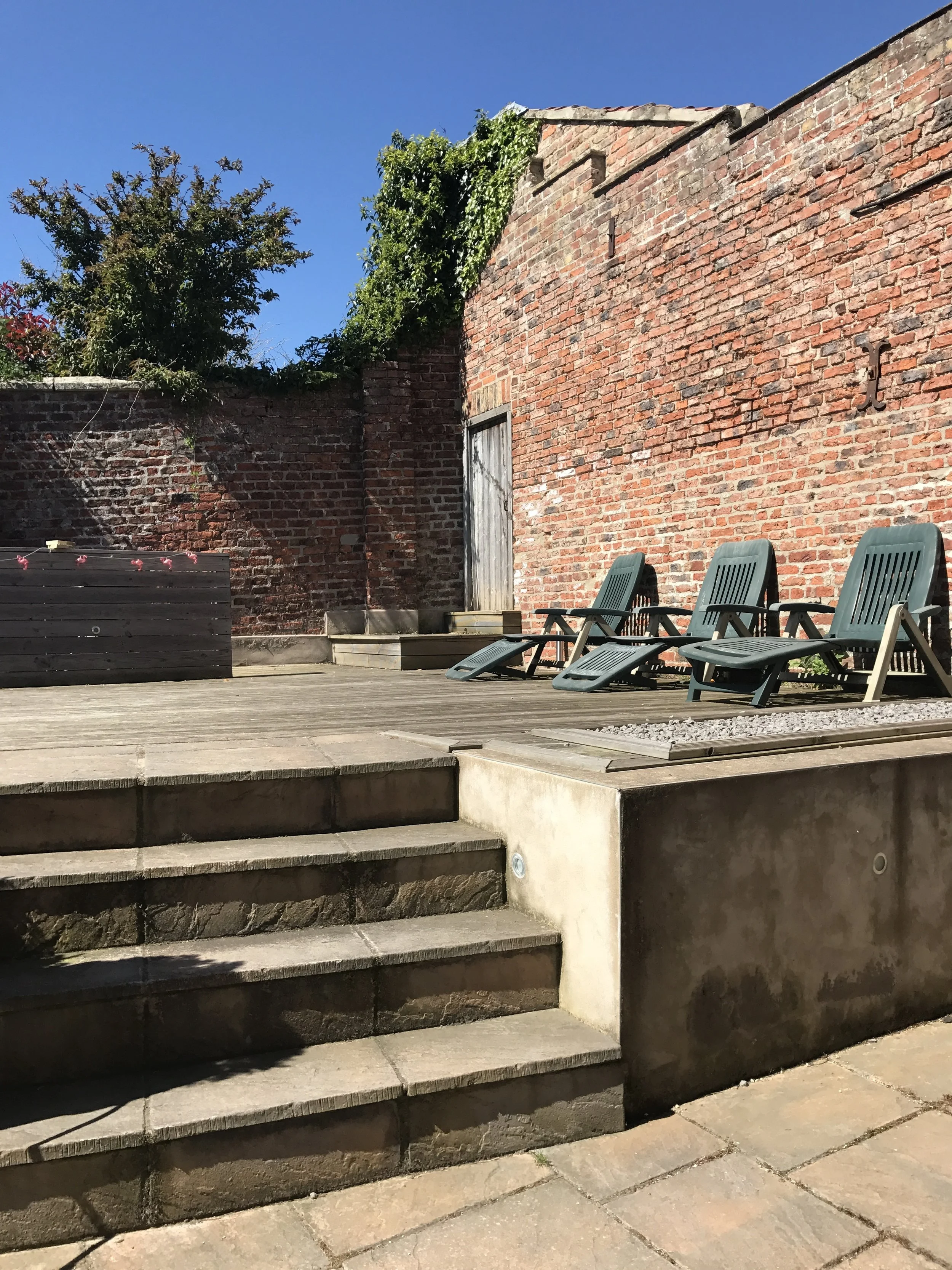 Our super scruffy decking that is due a makeover plus the BBQ area that is soon to become a tiki bar. Watch this space.