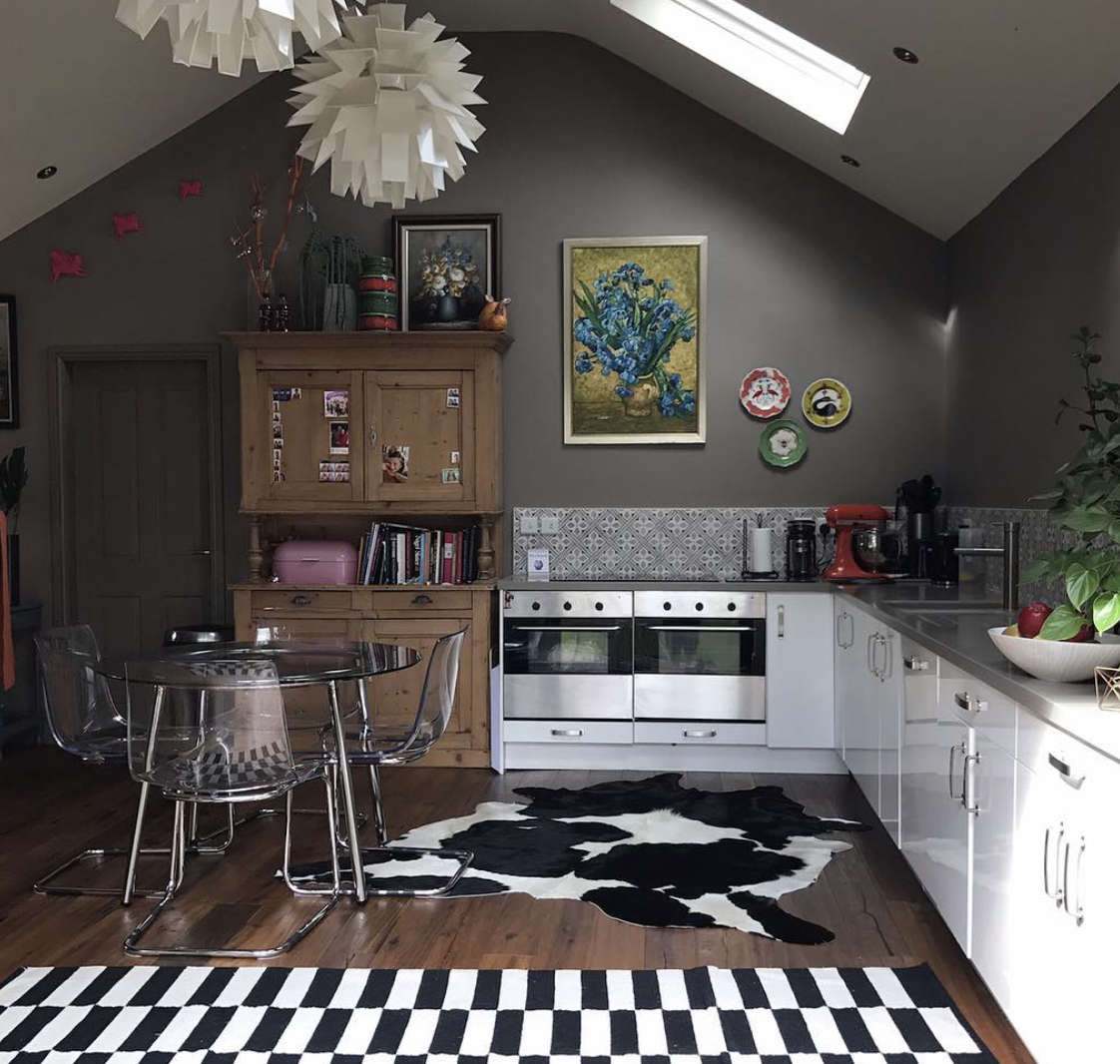 Julia from Surburban Salon has an eclectic mix of vintage oil painting and plates on her kitchen wall.