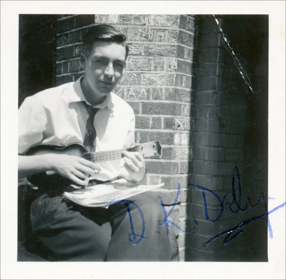 THE SEVENTEEN-YEAR-OLD KEVIN OUTSIDE HIS HOME, A COUNCIL FLAT IN MONTAGUE TIBBLES HOUSE, IN KENTISH TOWN, 1957