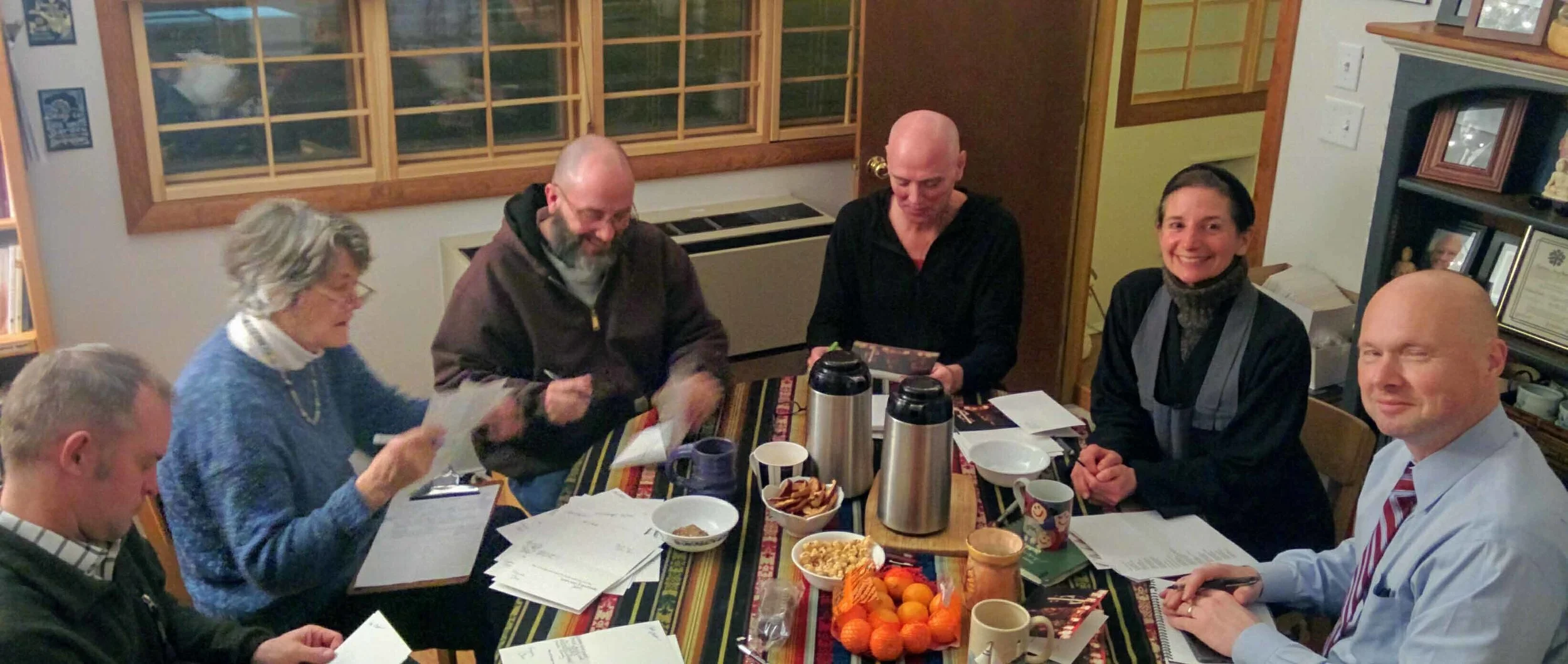 ZCNS+Leadership+at+Table+signing+cards+cropped.jpg