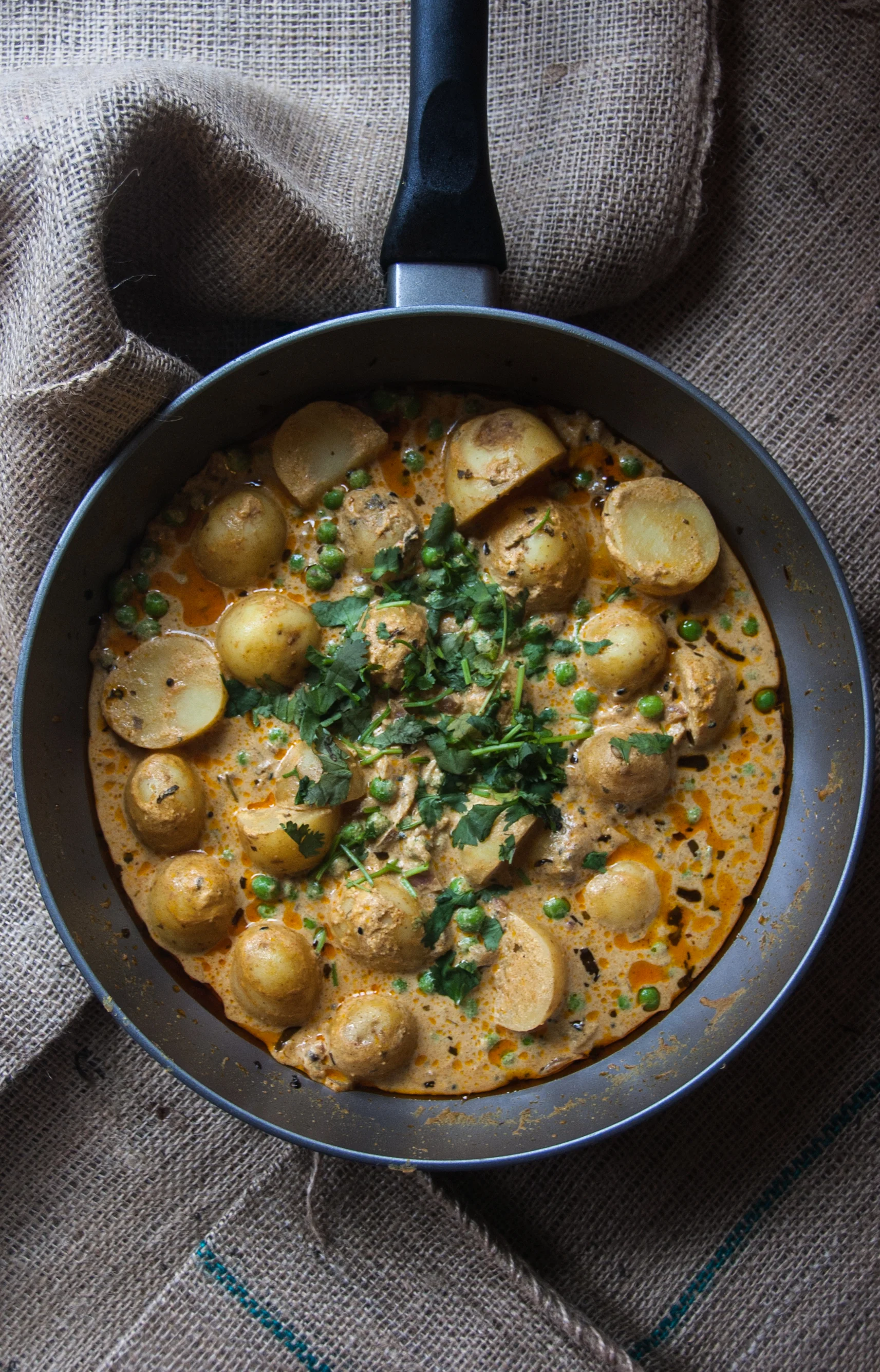 Potato and peas in yogurt curry