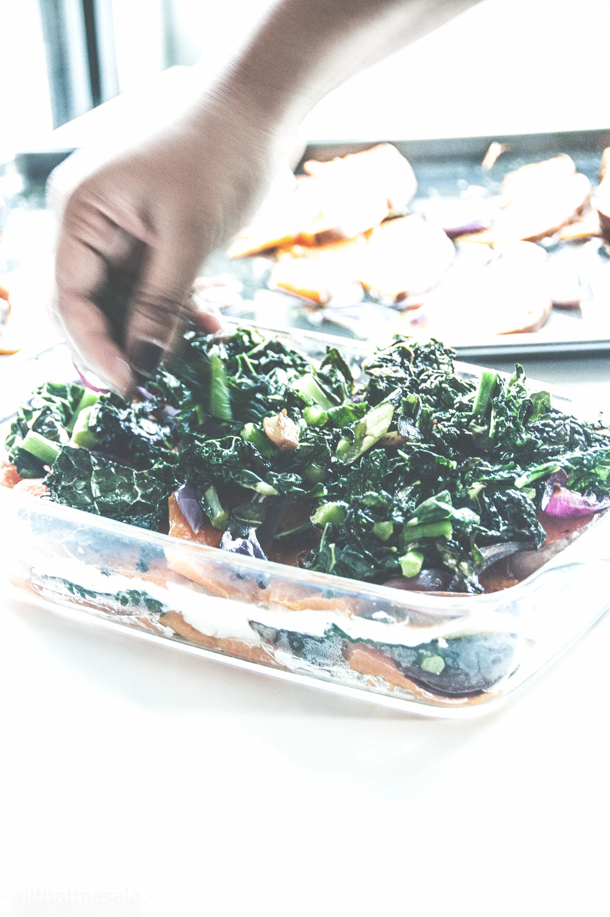 Pumpkin kale lasagna makes a warm pot of autumn dinner delight. This vegetarian lasagna recipe is made with baked cinderella pumpkin, stir fried kale, and warm gooey bechamel sauce.